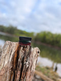 Two-tone stacked leather card wallet in black, green, and oxblood