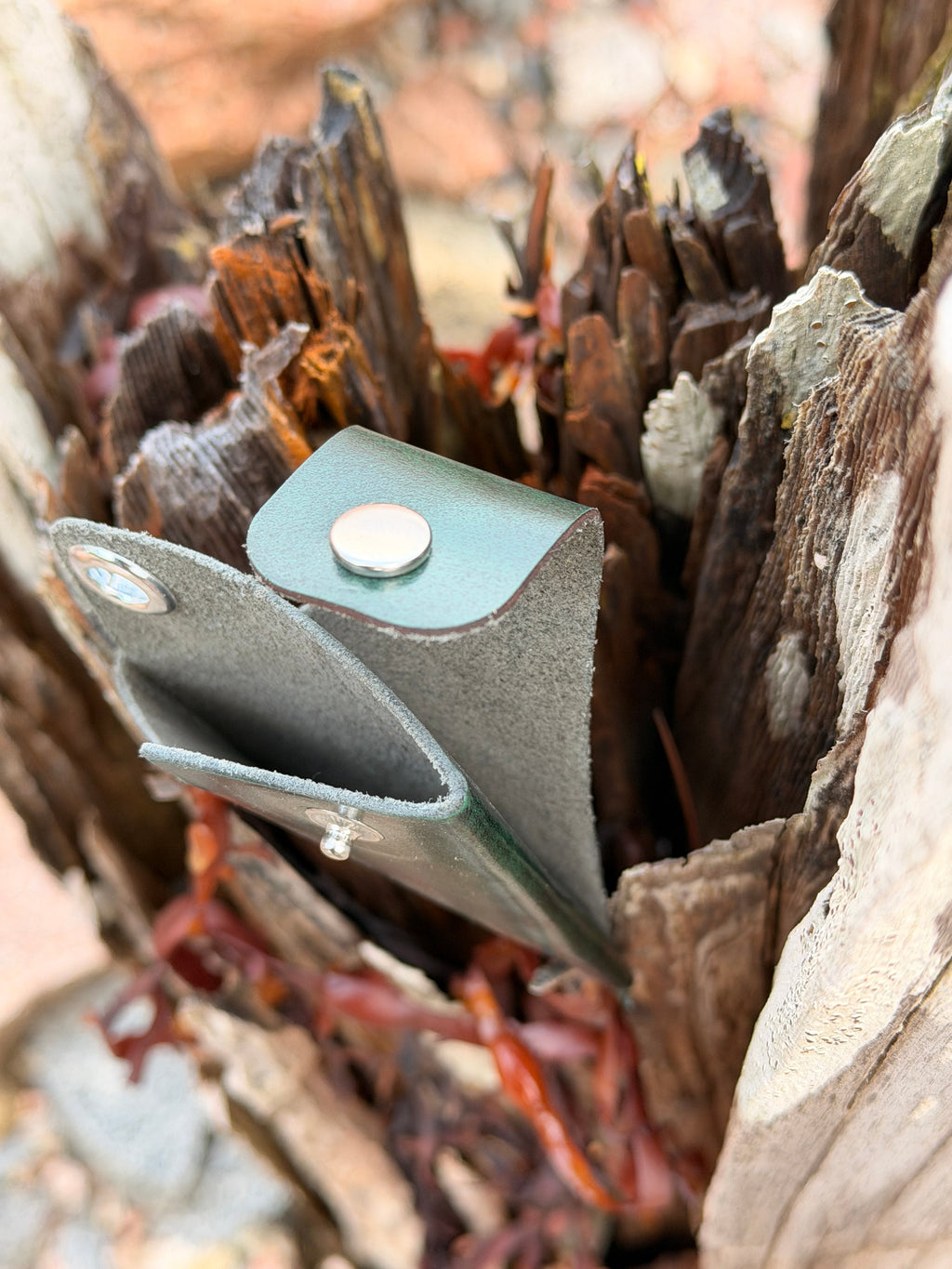 Forest green leather pouch with snap closure, handmade in Maine